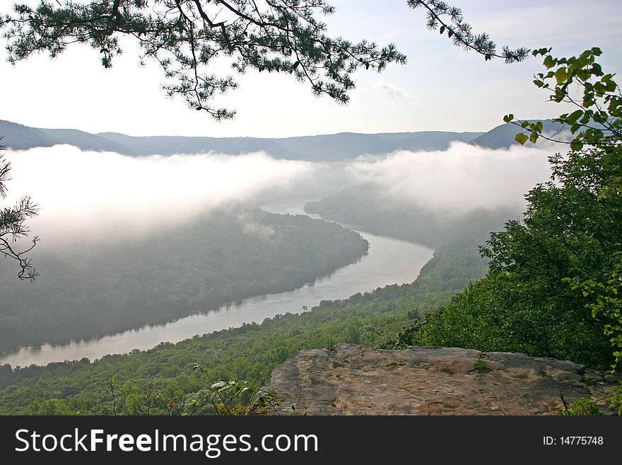 Low-hanging clouds over the Tennessee River, as seen from Snoopers Rock. Low-hanging clouds over the Tennessee River, as seen from Snoopers Rock