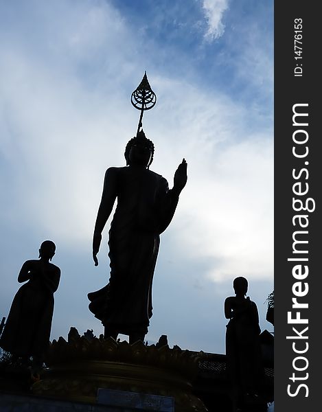 Silhouette of three Buddha statue.