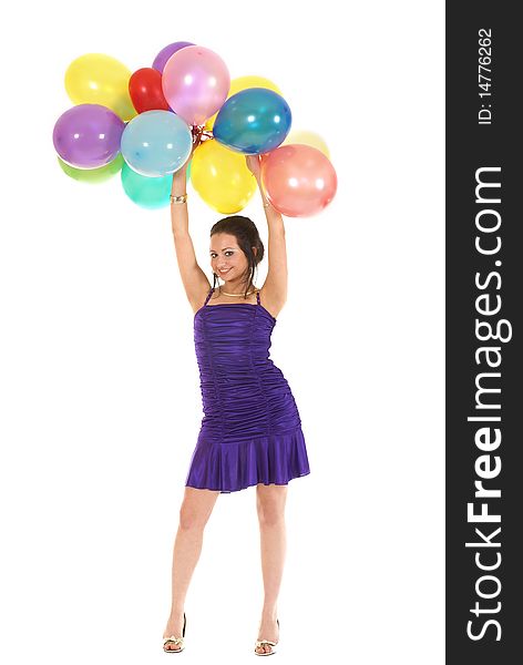 A young girl is holding a pack of party balloons