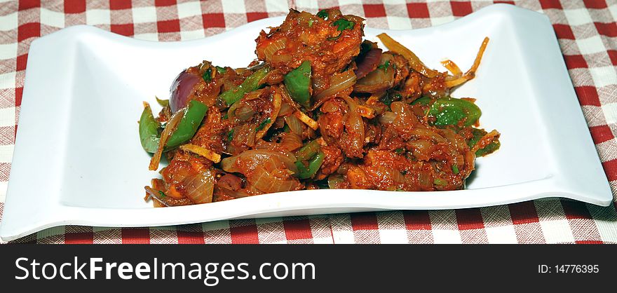 Chilly chicken in white bowl