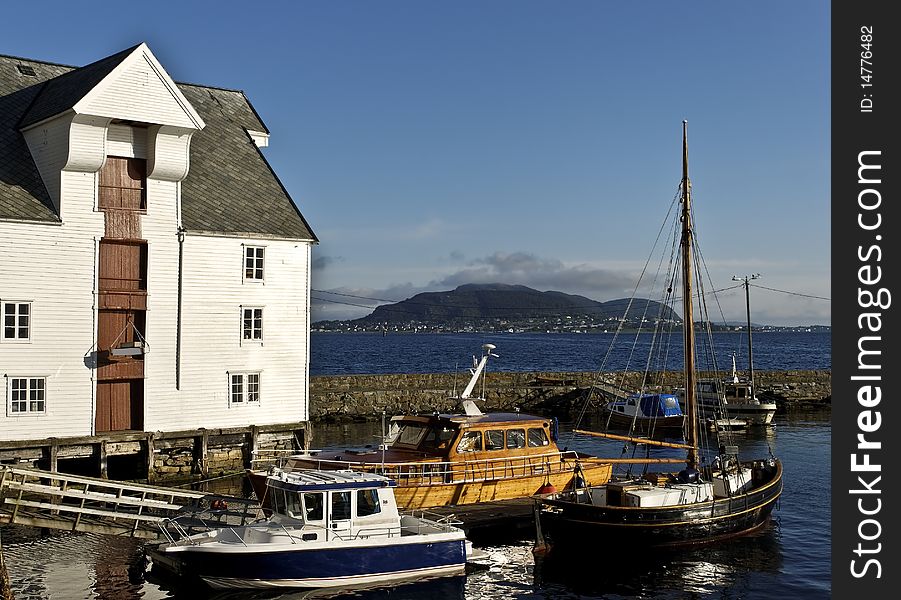 Alesund - one of the nicest cities of the northern Norway. Here there are severeal beautiful old and modern wharfs for both small fishing vessels and huge cruise ships. Alesund - one of the nicest cities of the northern Norway. Here there are severeal beautiful old and modern wharfs for both small fishing vessels and huge cruise ships