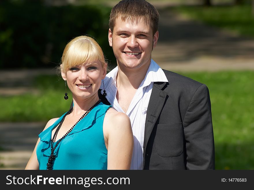 Portrait of a happy young couple in park