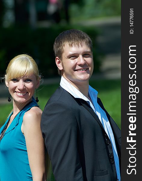 Portrait of a happy young couple in park