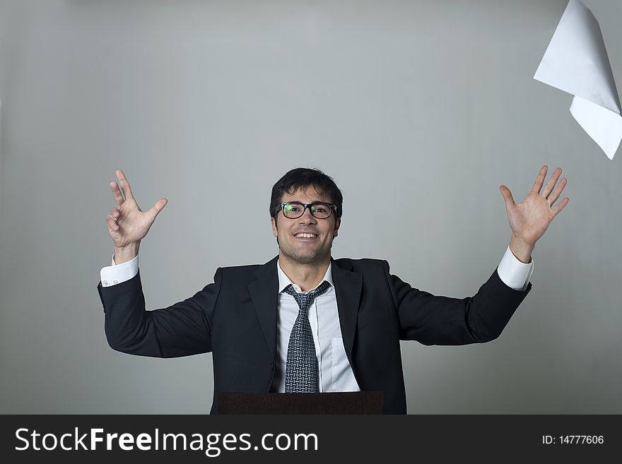 Businessman throwing documents away! Isolated on grey