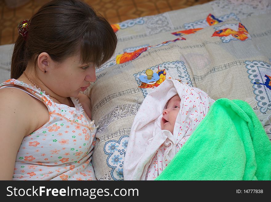 Photo of the beautiful baby on mother hands. Photo of the beautiful baby on mother hands