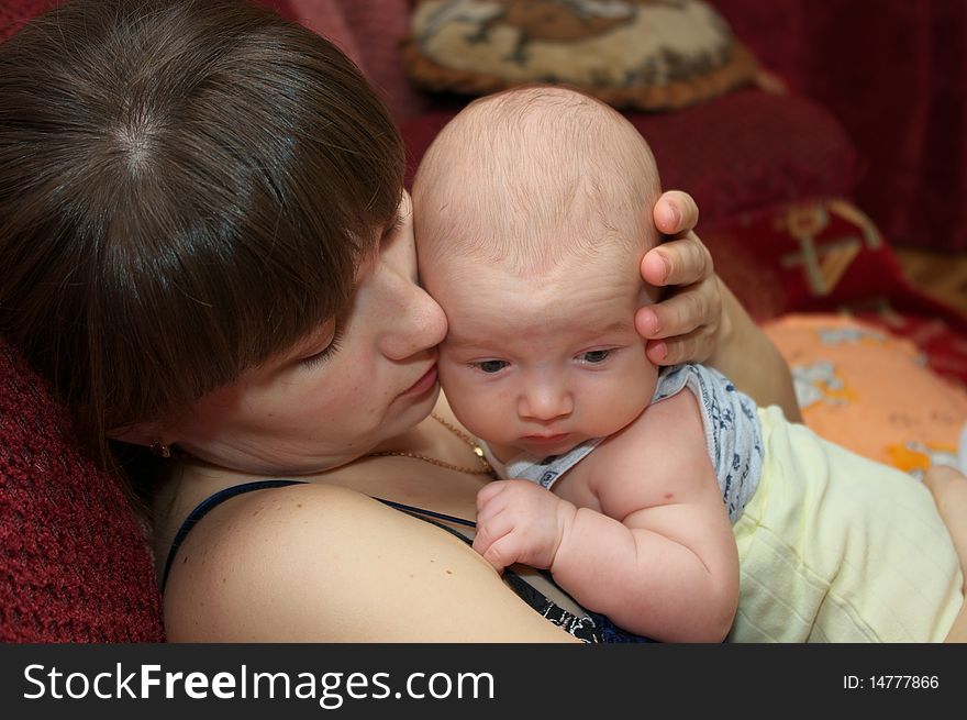 Photo of the beautiful baby on mother hands. Photo of the beautiful baby on mother hands