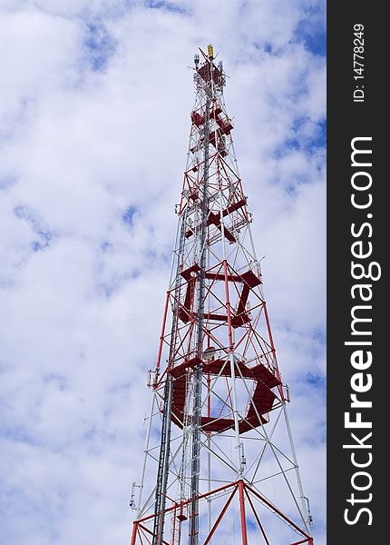 Tall red broadcasting on different frequencies antenna used for wireless telecommunication. Tall red broadcasting on different frequencies antenna used for wireless telecommunication