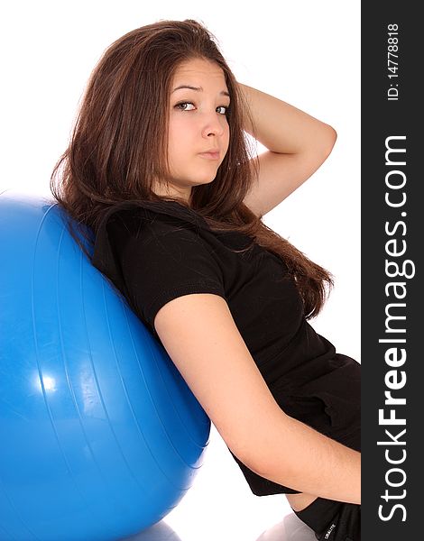 Girl-teenager about a gymnastic ball, on a white background it is isolated. Girl-teenager about a gymnastic ball, on a white background it is isolated.