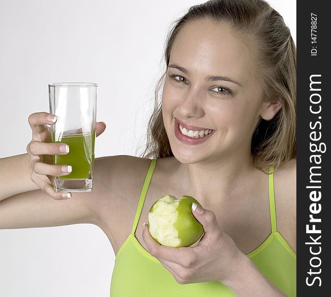 Woman with an apple and a glass of juice