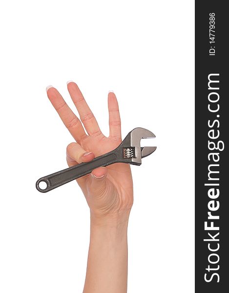 Woman holding adjustable spanner in the hand