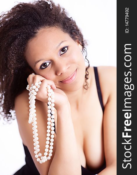 Portrait of a beautiful young afro-american woman with pearl necklace. Portrait of a beautiful young afro-american woman with pearl necklace