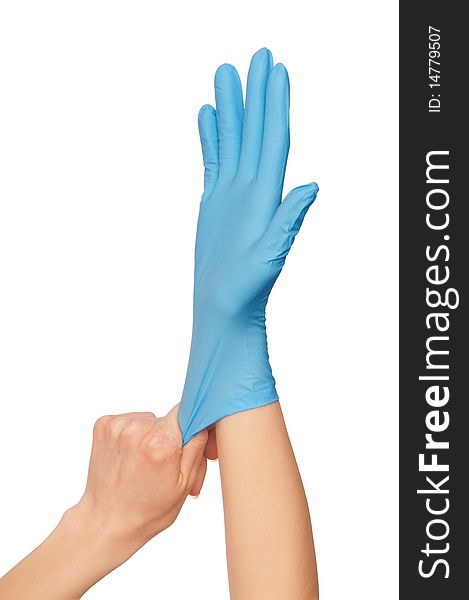 Doctor putting on blue sterilized medical glove for making operation