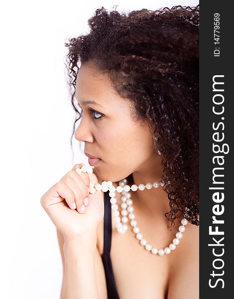 Portrait of a beautiful young afro-american woman with pearl necklace. Portrait of a beautiful young afro-american woman with pearl necklace