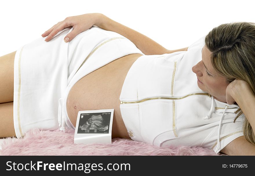 Pregnant woman with a sonogram of her baby