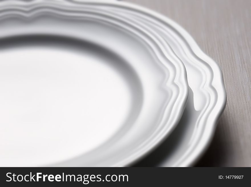 Two classic plates on a table cloth. Two classic plates on a table cloth