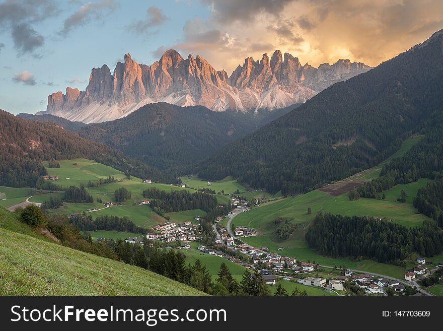 Small Italian Mountain Town Of St. Magdalena In Val Di Funes At Sunset