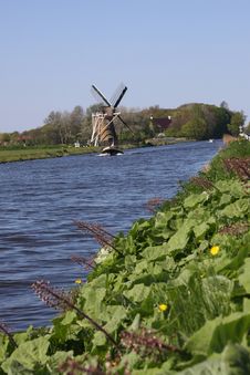 Windmill Alongside Canal. Royalty Free Stock Images Windmill Alongside Canal. Royalty Free Stock Images