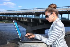 Businesswoman With Laptop On Quay Royalty Free Stock Photography