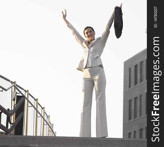 Standing businesswoman with a notebook