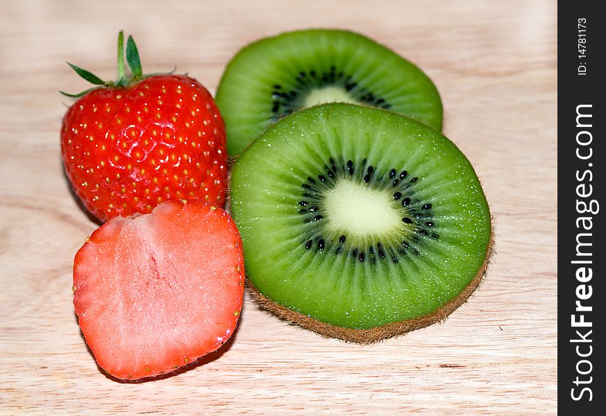 Kiwi slices strawberry slices on a broad. Kiwis are small fruits that pack a lot of flavour and plenty of health benefits. Their green flesh is sweet and tangy. It&#x27;s also full of nutrients like vitamin C, vitamin K, vitamin E, folate, and potassium. They also have a lot of antioxidants and are a good source of fibre. The flesh of the kiwi fruit is entirely edible and nutritious. This includes the green tissue, the yellow or white core, and the black seeds - all are edible. You can even eat the skin, but you might not enjoy the texture. Place the strawberry on cutting board. Cut four or five thin slices with a paring knife lengthwise through the strawberry, leaving slices attached just below the hull. Cut a few thin slices with a paring knife. Fan slices apart slightly, being careful to keep all slices attached to the hull. Strawberries are a healthy, low-calorie, sweet treat for your dog, full of antioxidants, high in fibre and vitamin C. Here&#x27;s a bonus. By giving your dog strawberries, you are also helping him stay healthy in more ways than one. ... Strawberries can also help whiten your pup&#x27;s teeth.
. Kiwi slices strawberry slices on a broad. Kiwis are small fruits that pack a lot of flavour and plenty of health benefits. Their green flesh is sweet and tangy. It&#x27;s also full of nutrients like vitamin C, vitamin K, vitamin E, folate, and potassium. They also have a lot of antioxidants and are a good source of fibre. The flesh of the kiwi fruit is entirely edible and nutritious. This includes the green tissue, the yellow or white core, and the black seeds - all are edible. You can even eat the skin, but you might not enjoy the texture. Place the strawberry on cutting board. Cut four or five thin slices with a paring knife lengthwise through the strawberry, leaving slices attached just below the hull. Cut a few thin slices with a paring knife. Fan slices apart slightly, being careful to keep all slices attached to the hull. Strawberries are a healthy, low-calorie, sweet treat for your dog, full of antioxidants, high in fibre and vitamin C. Here&#x27;s a bonus. By giving your dog strawberries, you are also helping him stay healthy in more ways than one. ... Strawberries can also help whiten your pup&#x27;s teeth.