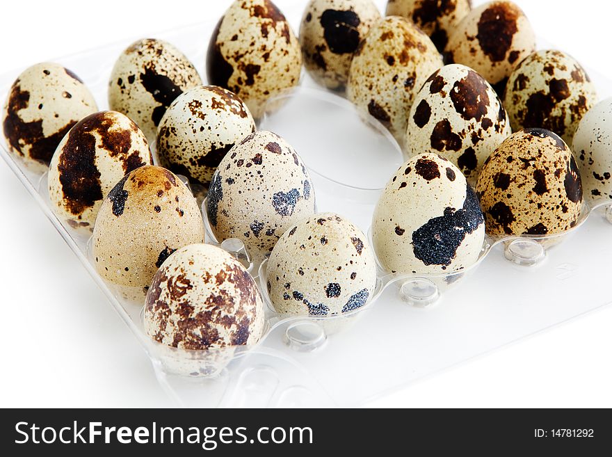 Quail eggs on white background