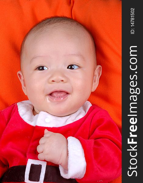 The Chinese infant baby boy smiling. The Chinese infant baby boy smiling