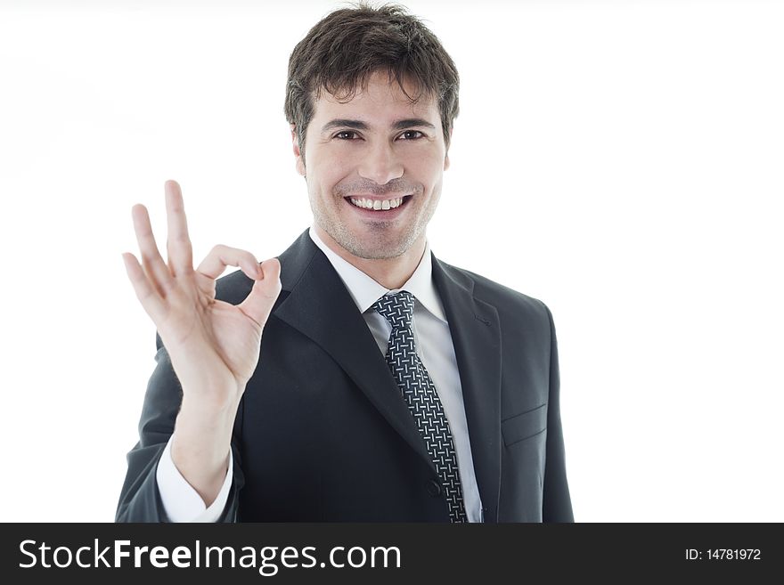 Businessman showing OK sign, white background