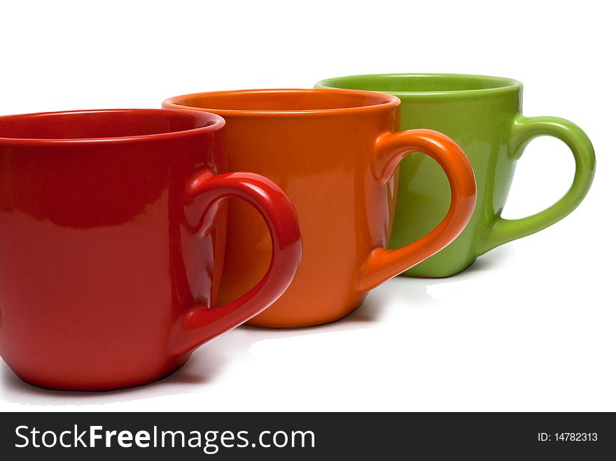 Three cups of different colors, arranged in a row.