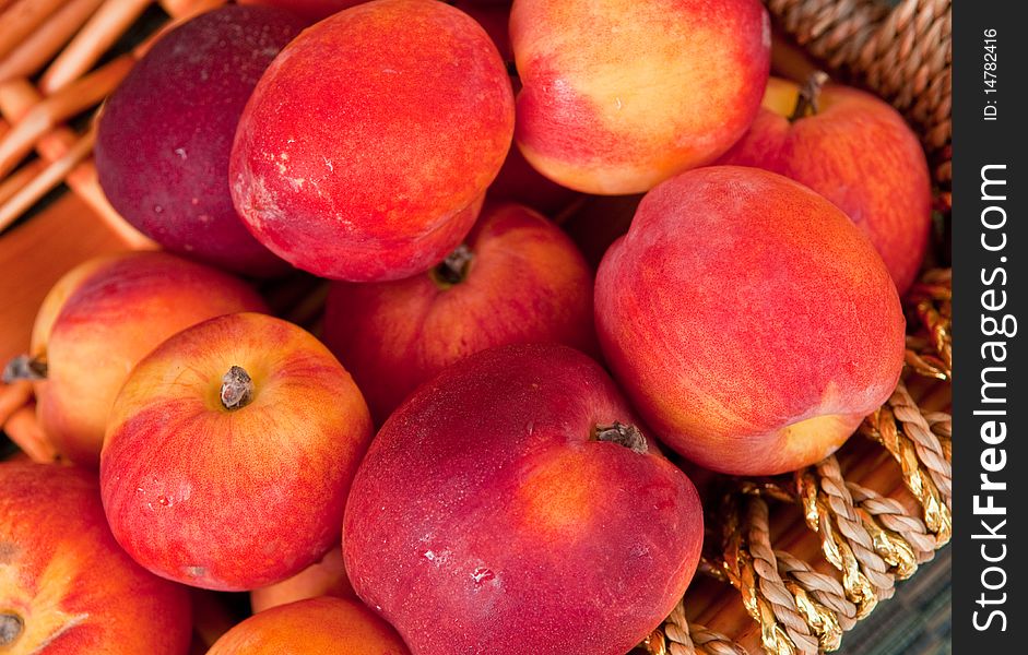 A basket of fresh nectarines plucked straight from the orchard