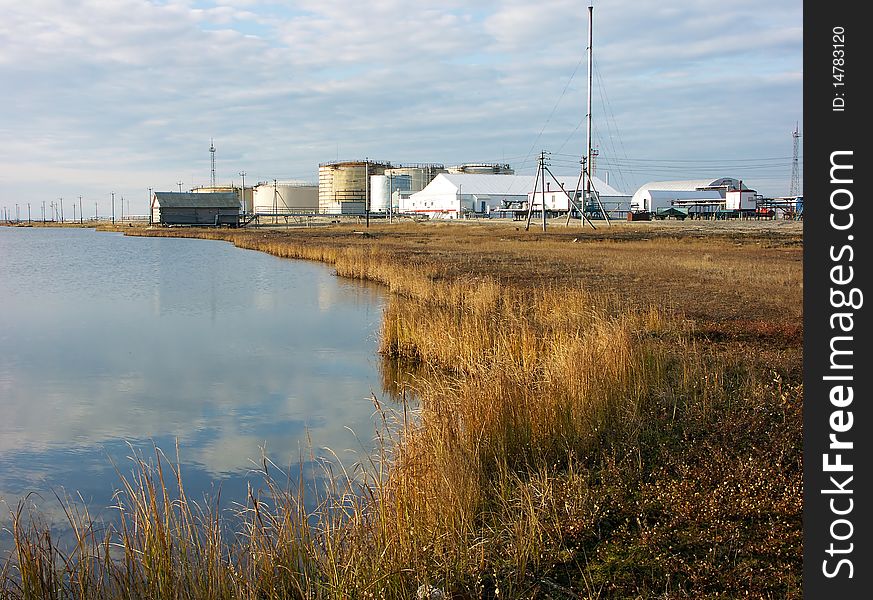 Oil terminal and grass in the evening light.