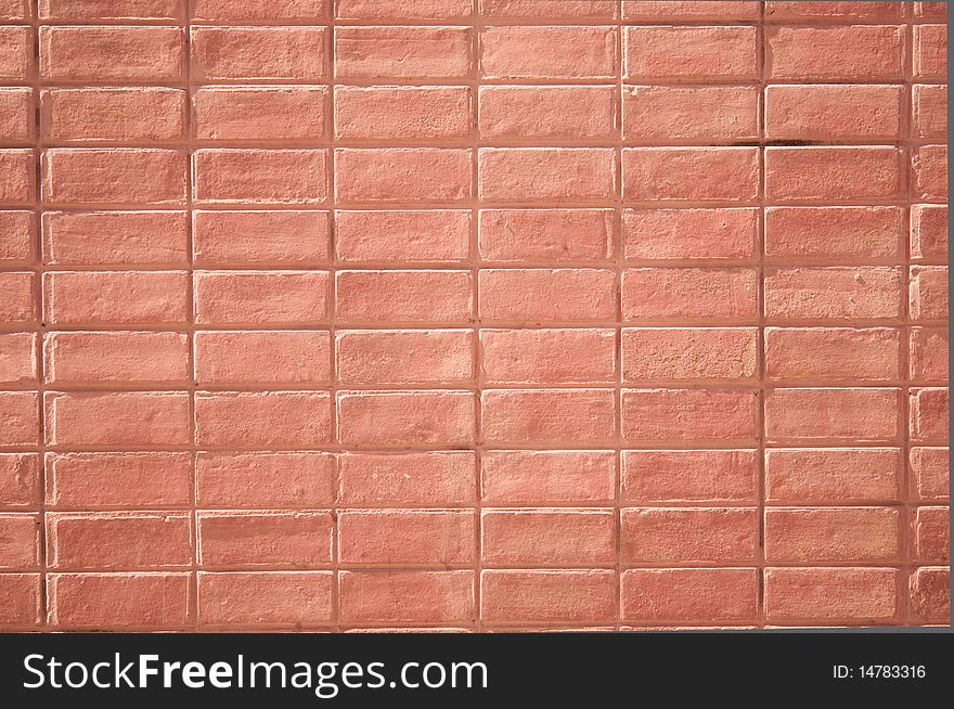 Rectangular red brick wall with strong lighting