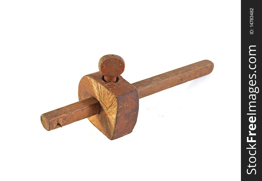 Old gauge used by carpenters on a plain white background.