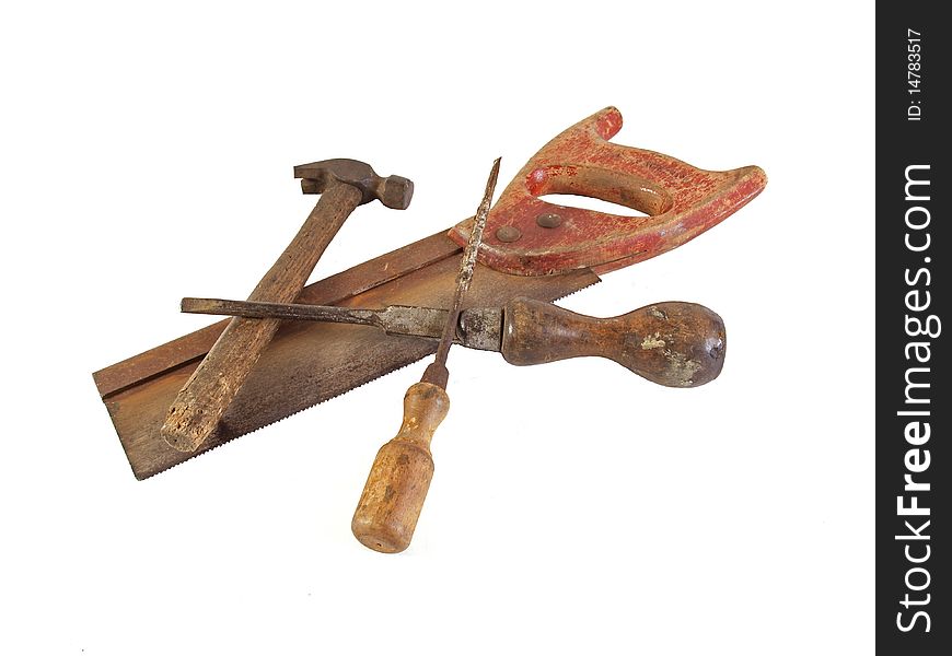 Assorted old hand tools on a plain white background.