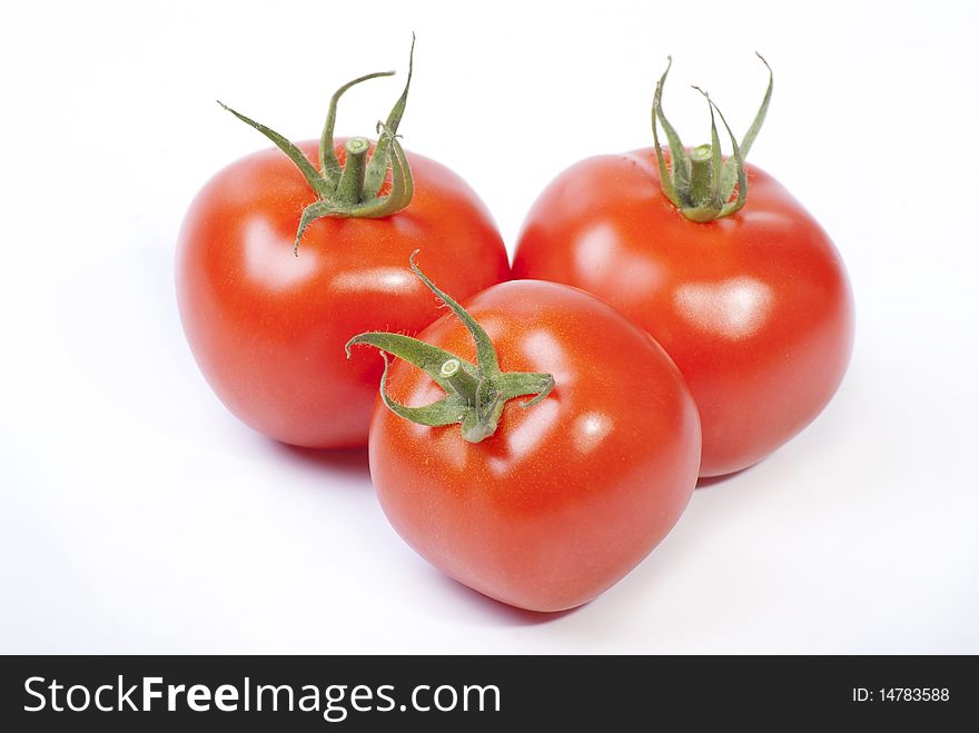 Three red tomato isolated on white background. Three red tomato isolated on white background