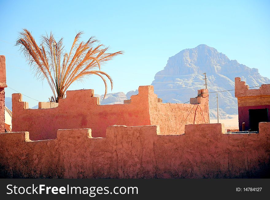 Fortress wall against the blue sky in a desert in Jordan