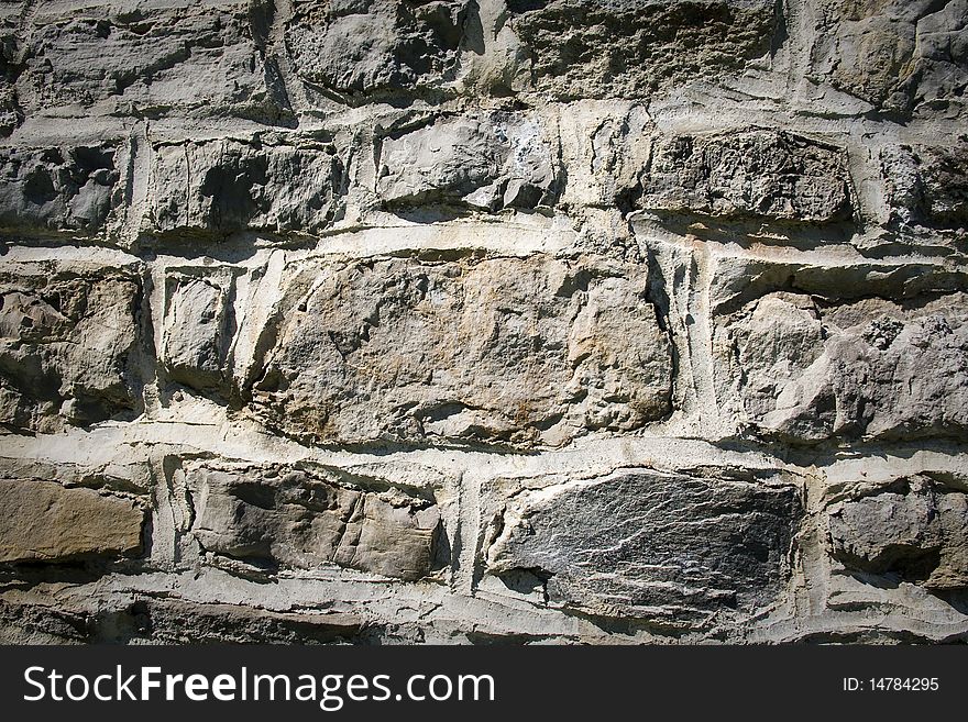 Background stone wall with brighter center. Background stone wall with brighter center