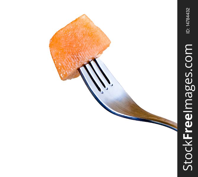 Fresh melon and a fork isolated on a white background.