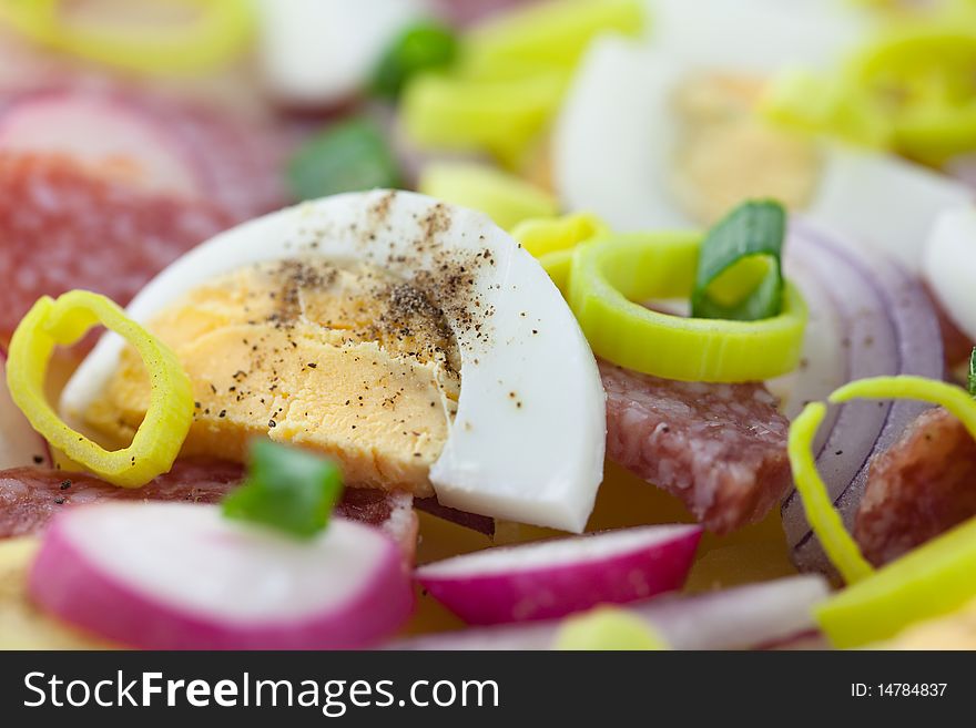 Salami and egg salad with vegetables