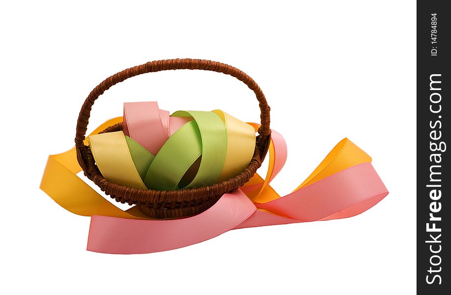 Ribbon in the basket on a white background