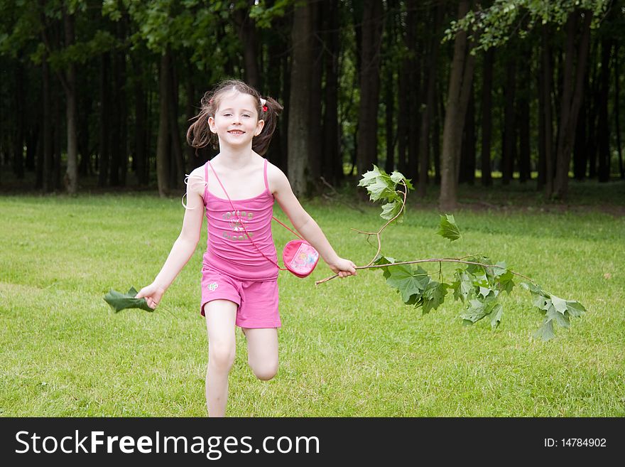 Little girl running in a park in summer. Little girl running in a park in summer.