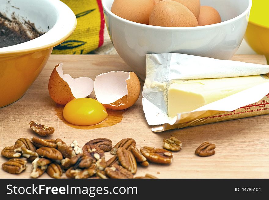Butter and eggs, pecans are featured for a day of baking. Butter and eggs, pecans are featured for a day of baking.
