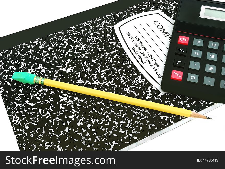 Yellow pencil and black calculator on classic composition black and white notebook. Yellow pencil and black calculator on classic composition black and white notebook