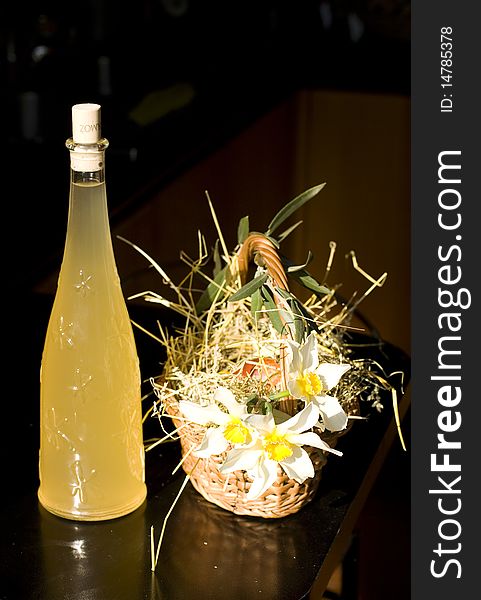 Easter basket with a bottle of white wine. Easter basket with a bottle of white wine