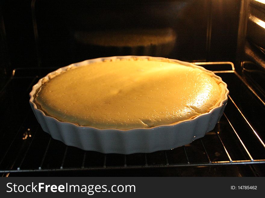 Fresh yellow lemon tart in oven