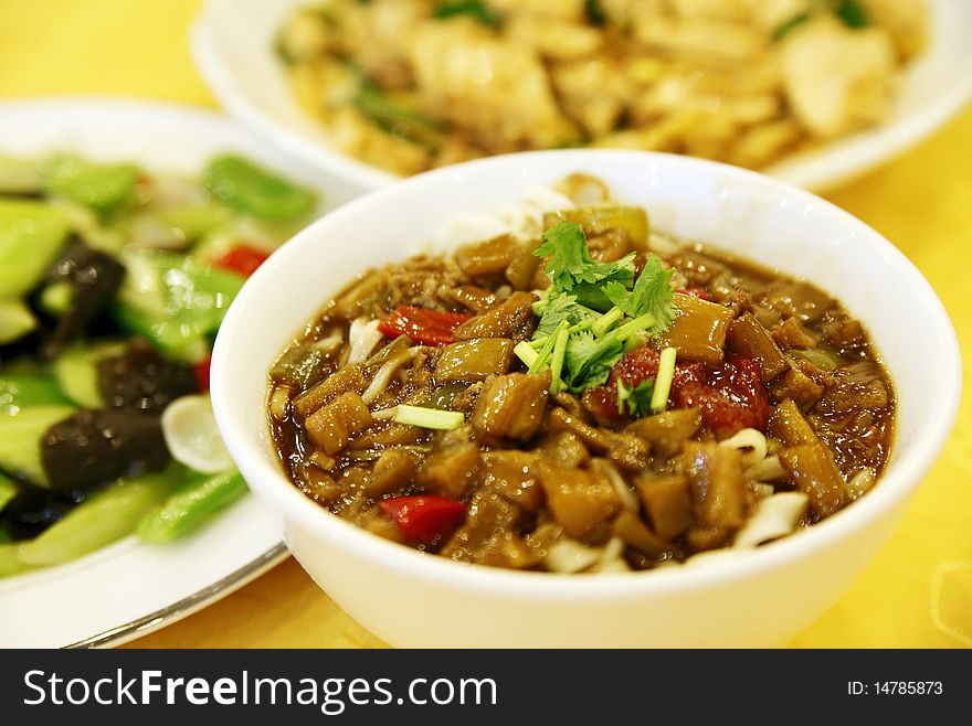 Delicious Chinese noodles on the table(with eggplant sauce ).