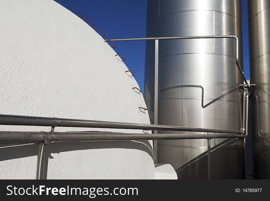 Stainless steel and concrete tanks in a winery, Alentejo, Portugal