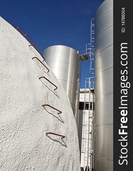 Stainless steel and concrete tanks in a winery, Alentejo, Portugal