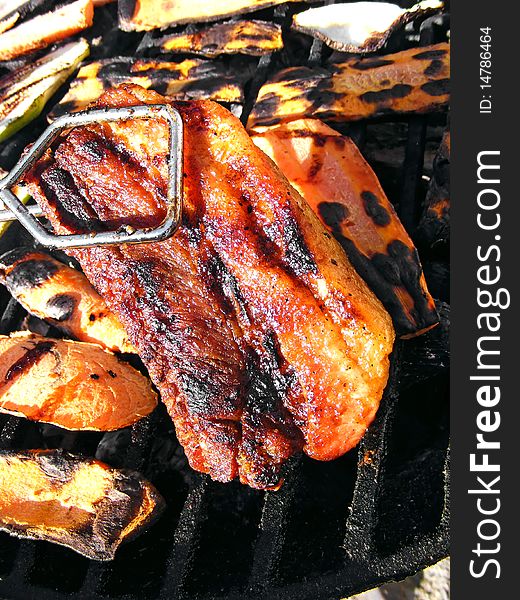 Sausage on barbecue with wooden coals - close up. Sausage on barbecue with wooden coals - close up