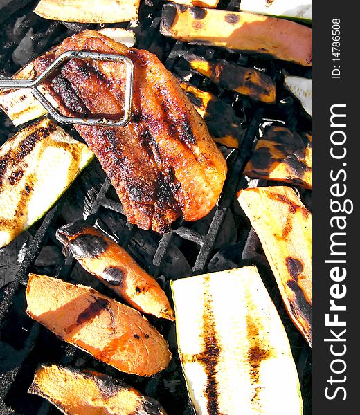 Sausage on barbecue with wooden coals - close up. Sausage on barbecue with wooden coals - close up
