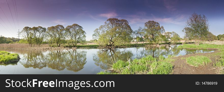 Panorama of the river with reflexion of trees in water. Panorama of the river with reflexion of trees in water